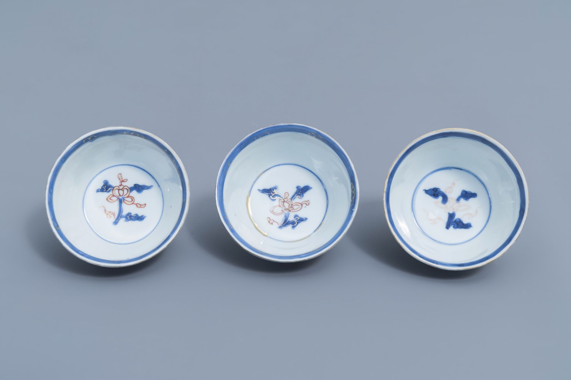 Six Chinese blue, white, iron red and gilt cups and saucers with floral design, Kangxi - Image 34 of 34