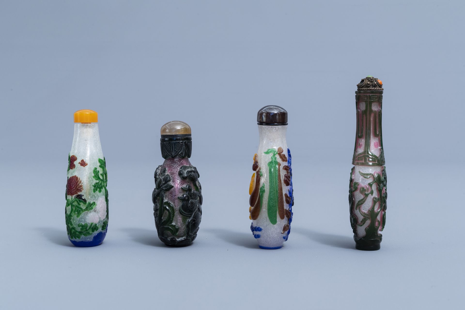 Eight Chinese multi-colour overlay glass snuff bottles, 20th C. - Image 4 of 4