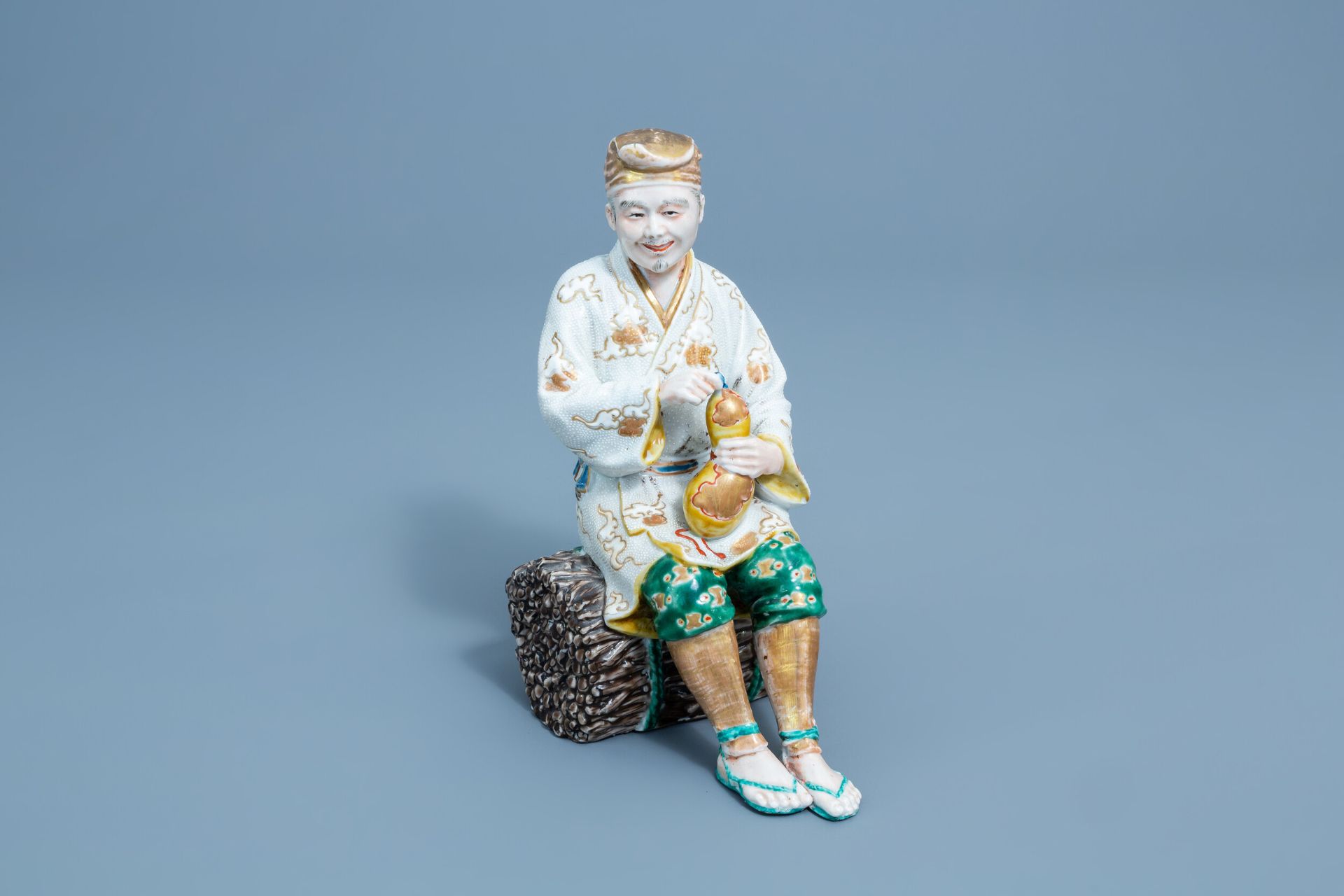 A Japanese Kutani model of a resting man, Meiji