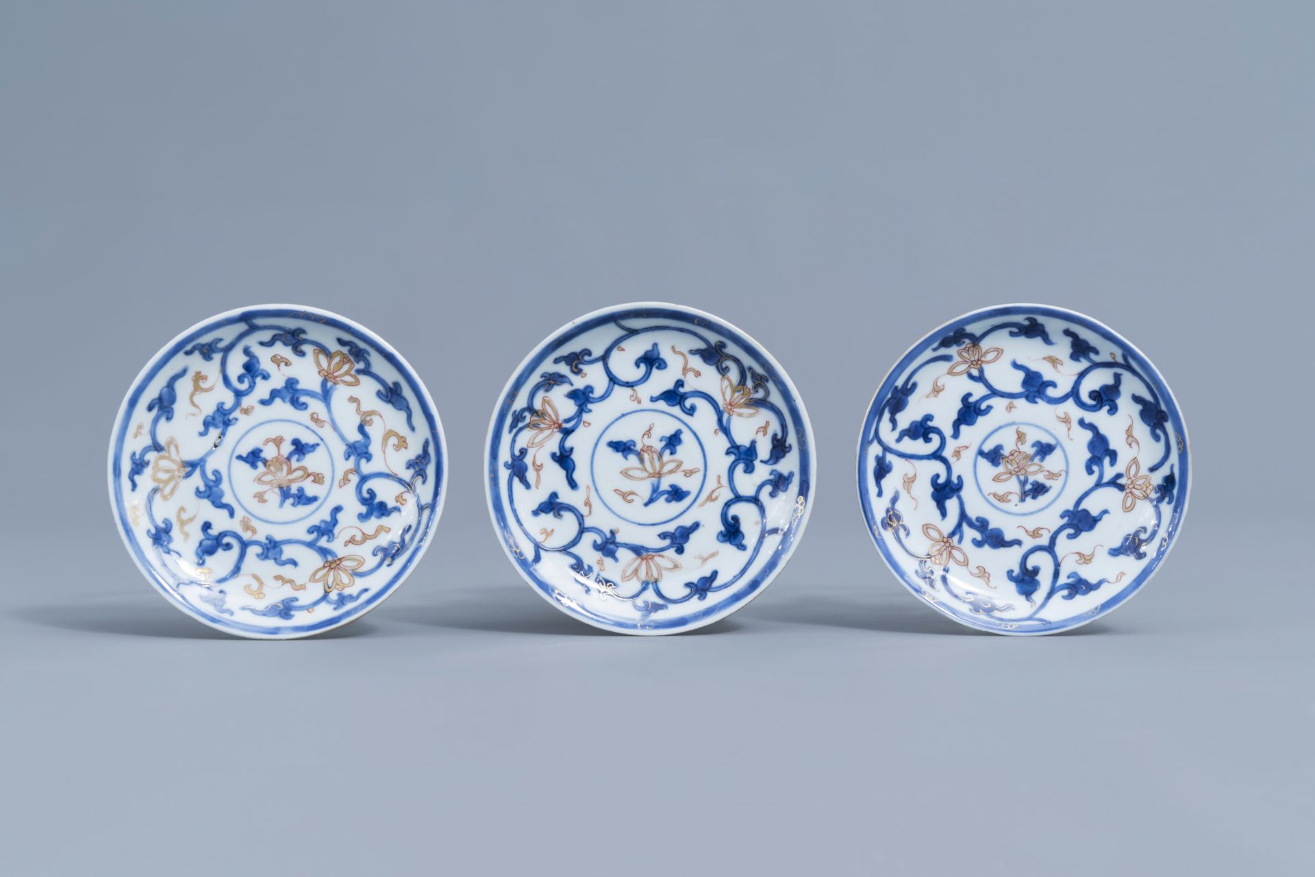 Six Chinese blue, white, iron red and gilt cups and saucers with floral design, Kangxi - Image 7 of 34