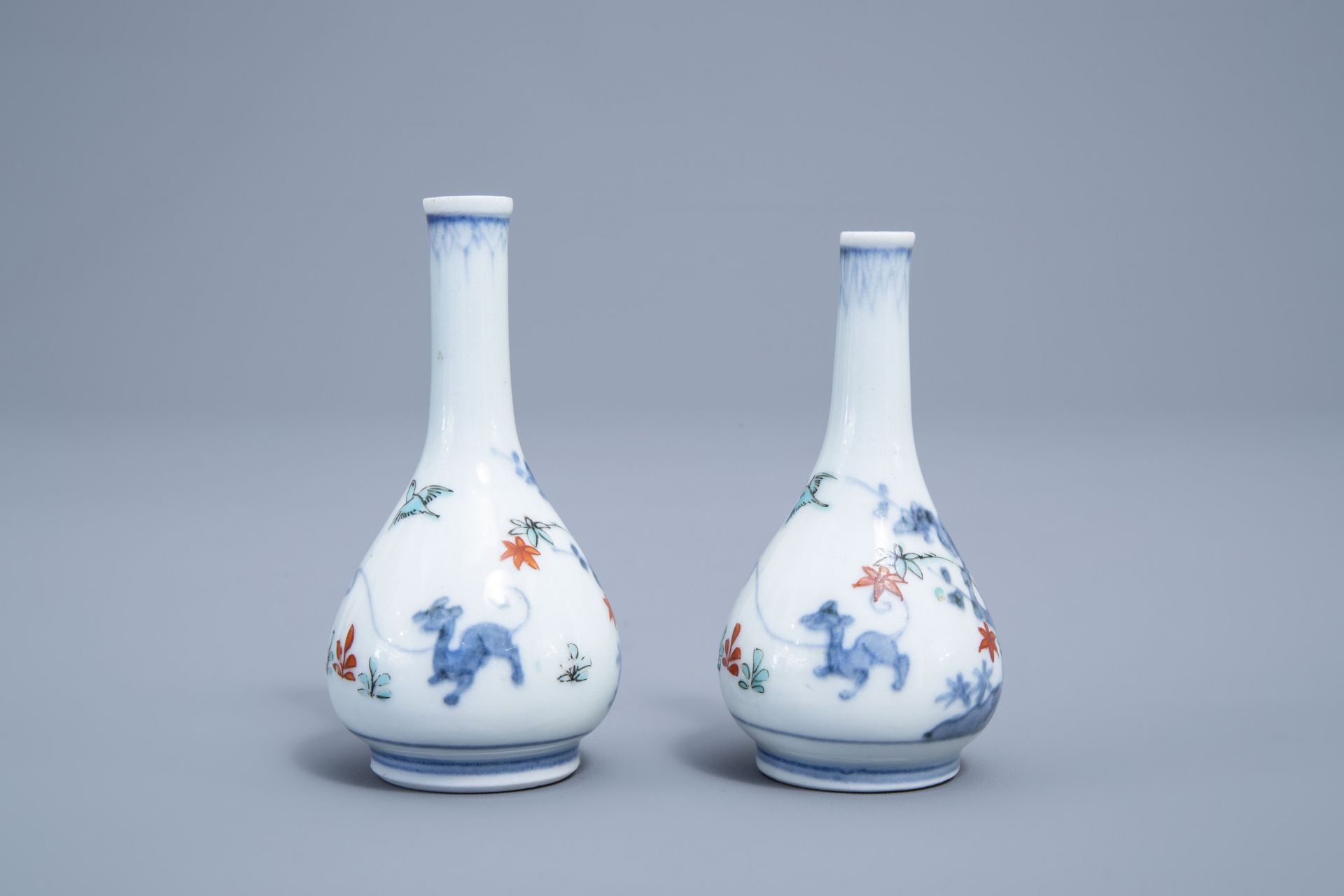 A pair of Japanese Kakiemon doll's house miniature vases with a playing child, Edo, 17th/18th C. - Image 2 of 6