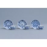 Three Chinese blue and white cups and saucers with floral design, Kangxi