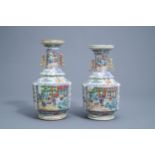 Two Chinese Canton famille rose vases with a lotus shaped neck, 19th C.