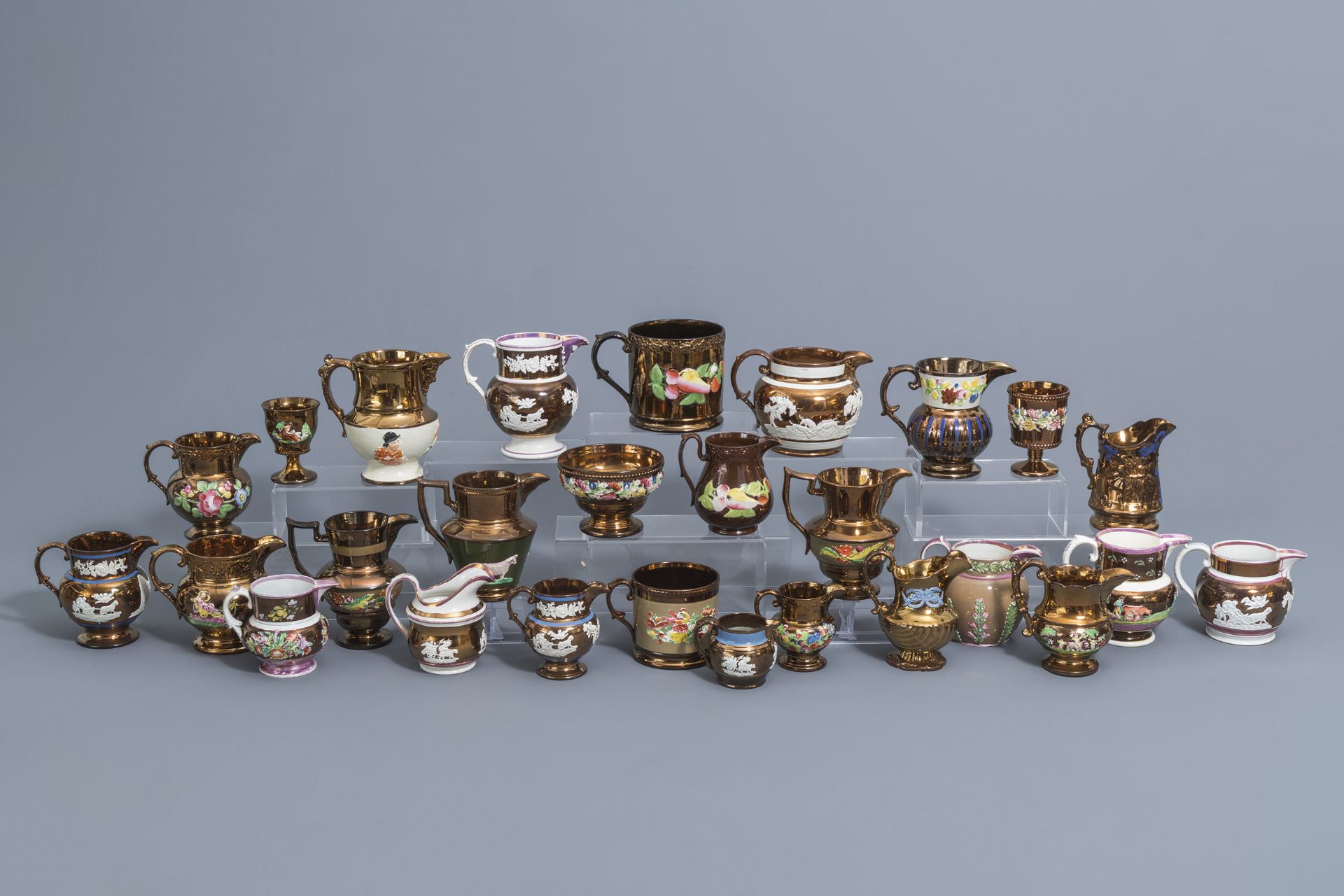 A varied collection of English lustreware items with relief design, 19th C.