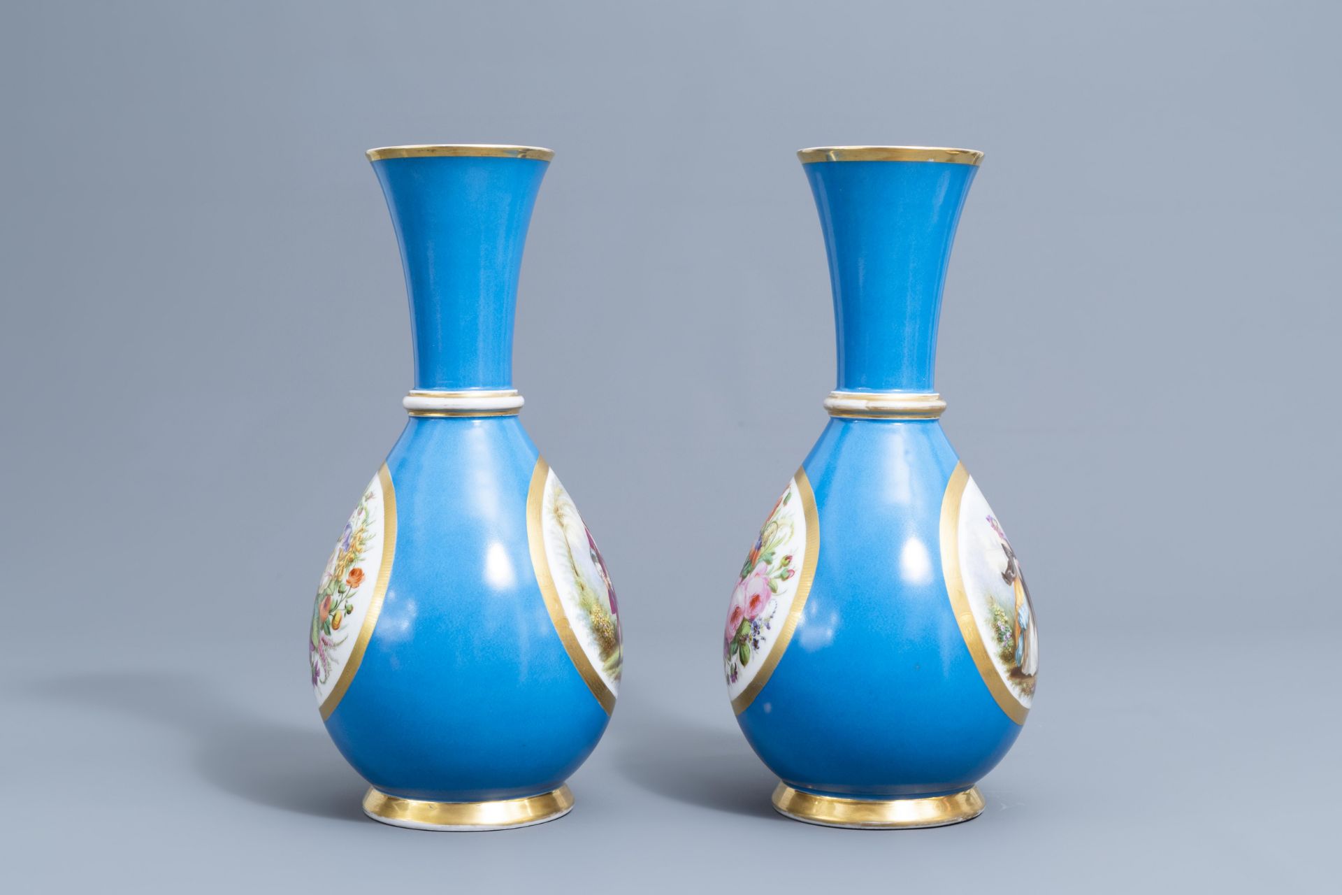 A pair of French 'bleu celeste' ground vases with gallant scenes and a German gilt charger, 20th C. - Image 5 of 24