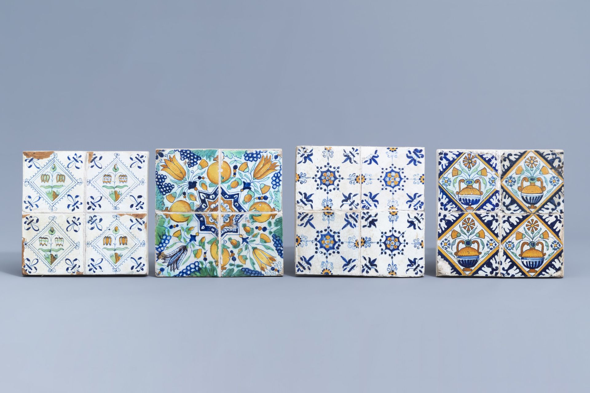 Sixteen Dutch Delft polychrome tiles with floral design, 17th C.