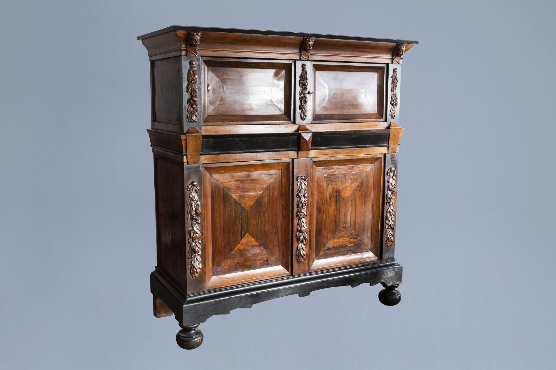 A Dutch wooden four-door cupboard, 17th C. and later