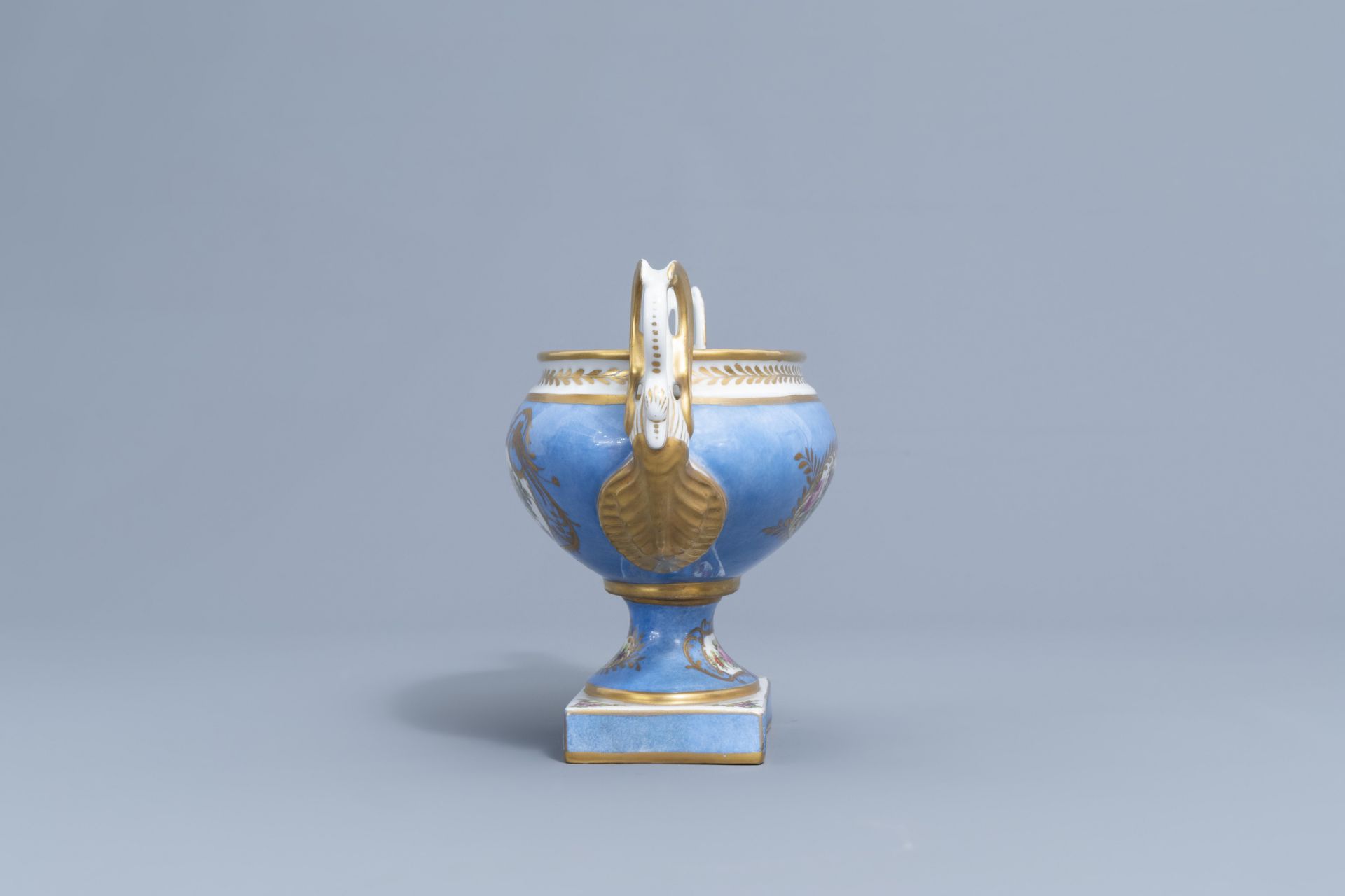 A pair of French 'bleu celeste' Svres manner vases and an Empire style centrepiece, 19th/20th C. - Image 20 of 28