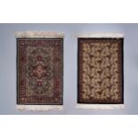 Two Oriental rugs with floral design, silk on cotton, 20th C.