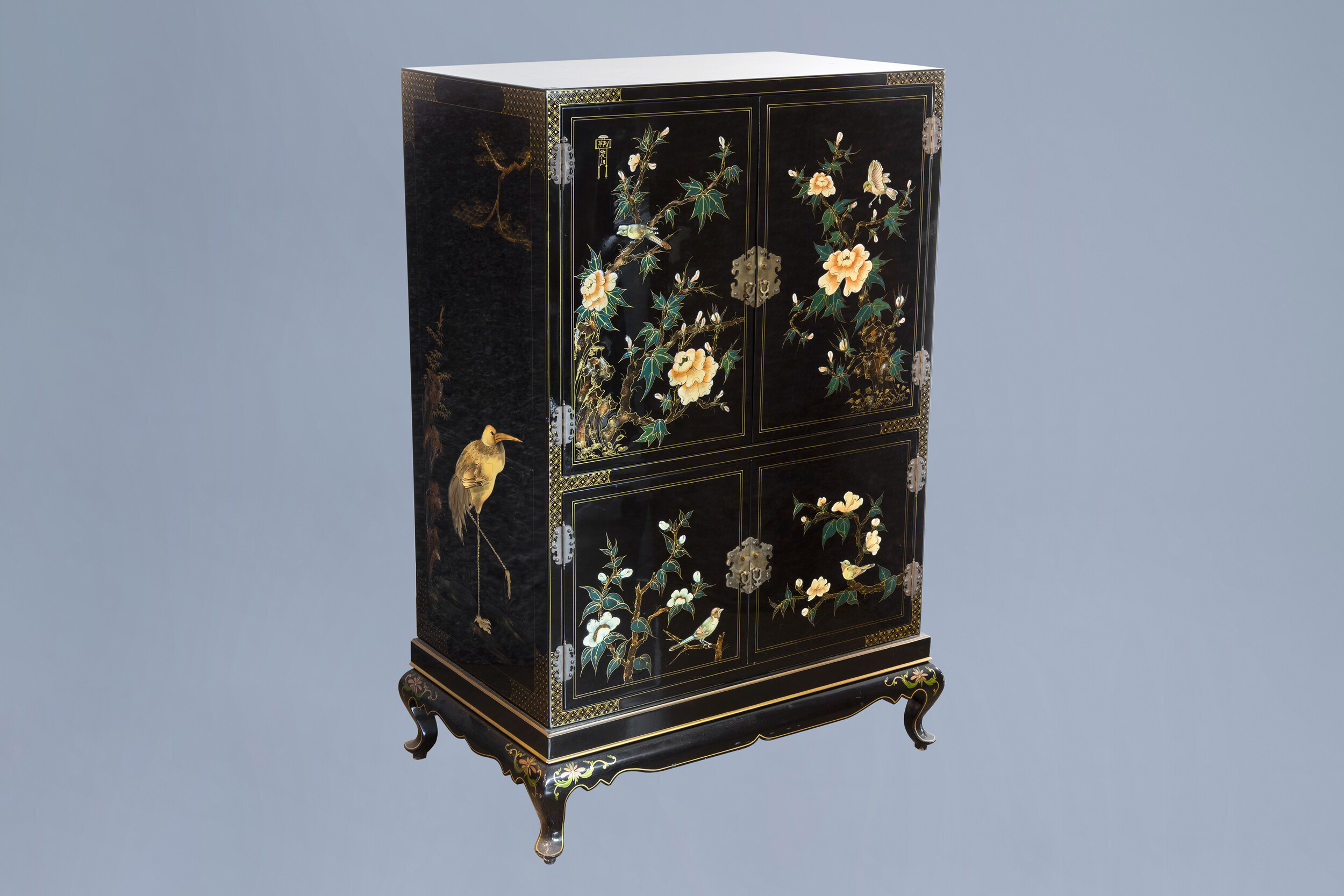 A lacquered Chinese cupboard with birds among blossoming branches, 20th C.