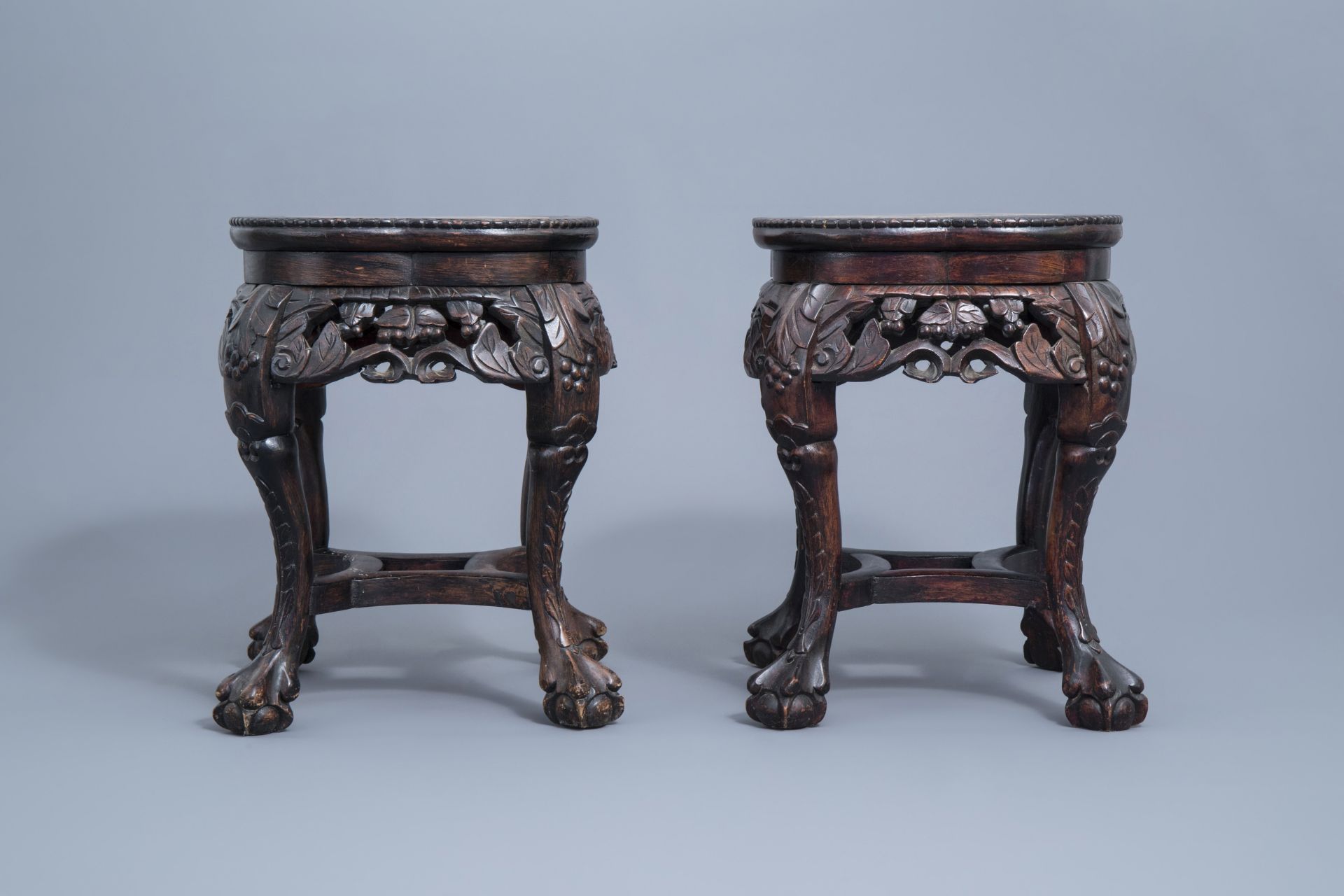 A pair of Chinese carved wooden stands with marble top, 19th/20th C. - Image 2 of 7