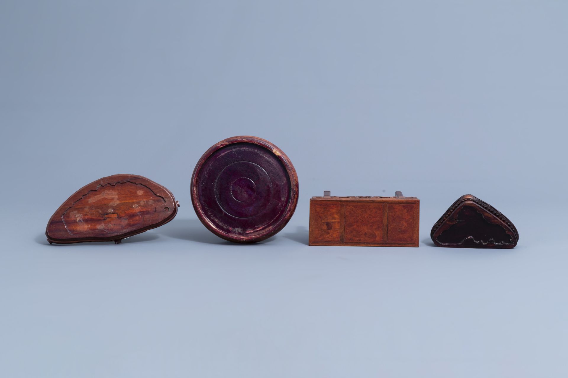 A collection of Chinese carved wooden stands, 19th/20th C. - Image 25 of 32