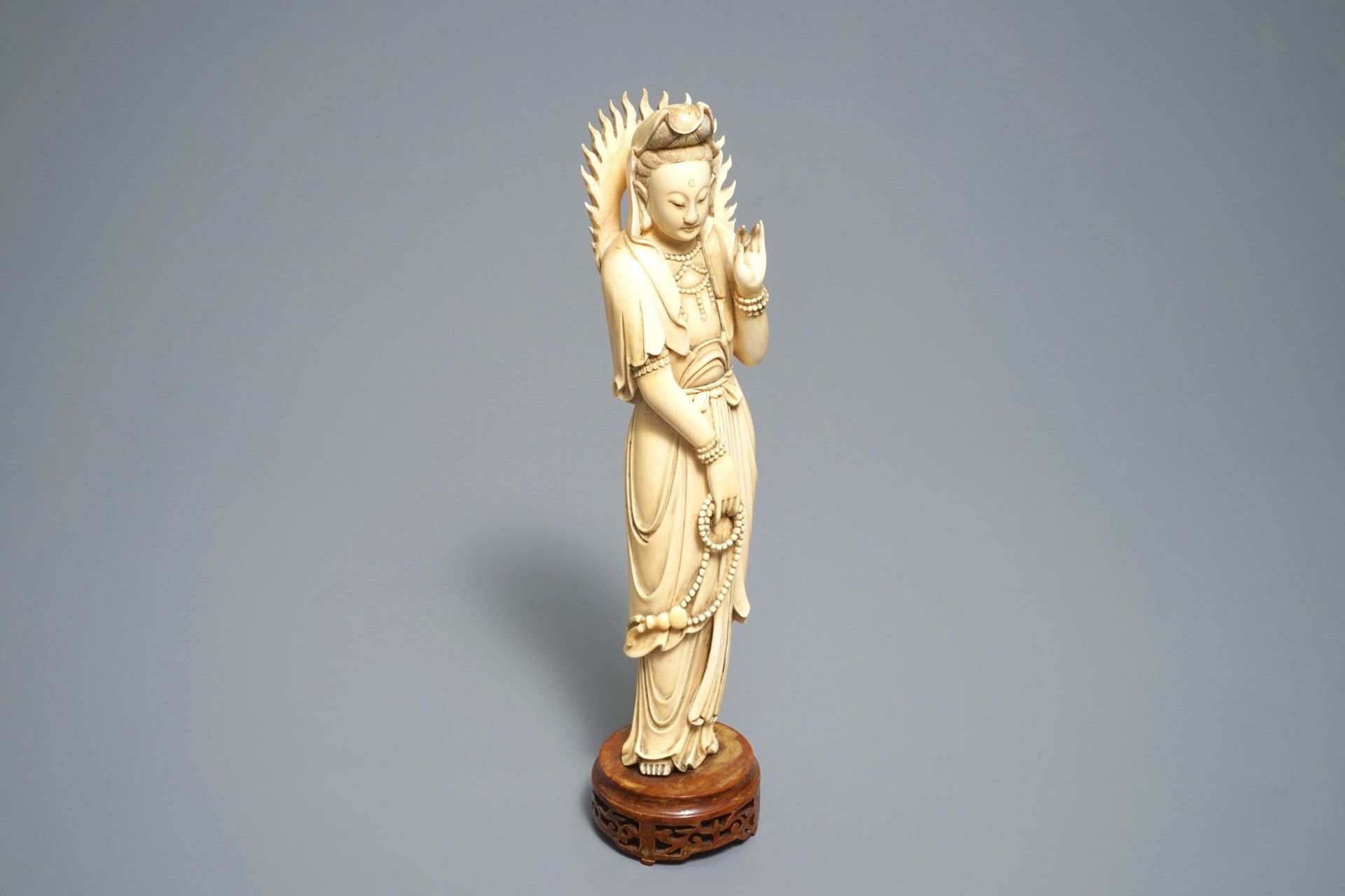 A Chinese carved ivory figure of Guanyin, 19th C.