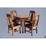 Four Chinese or Vietnamese mother-of-pearl inlaid wooden chairs and a round table, 20th C.