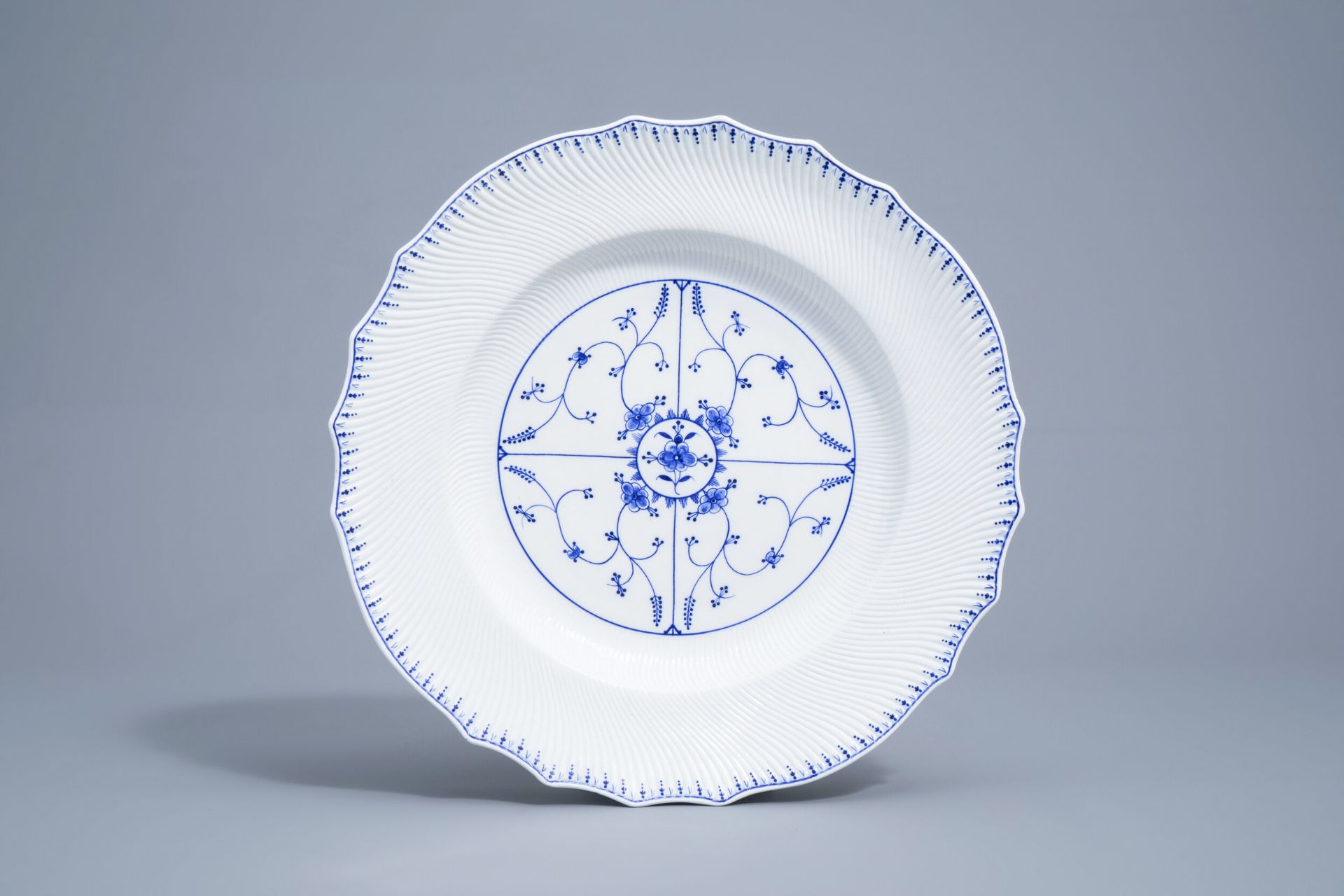 A large blue and white Tournai porcelain lobed charger with floral design, 19th C. - Image 2 of 6