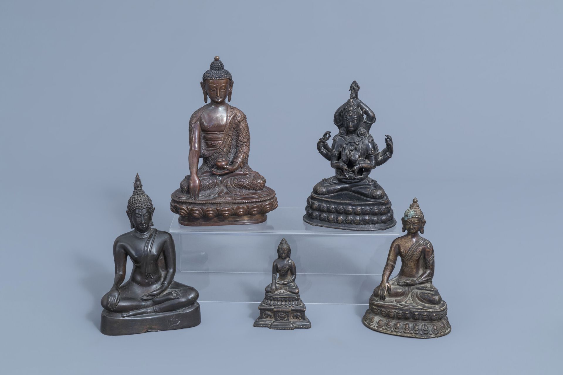 Five bronze figures of Buddha, China and Southeast Asia, 19th/20th C.