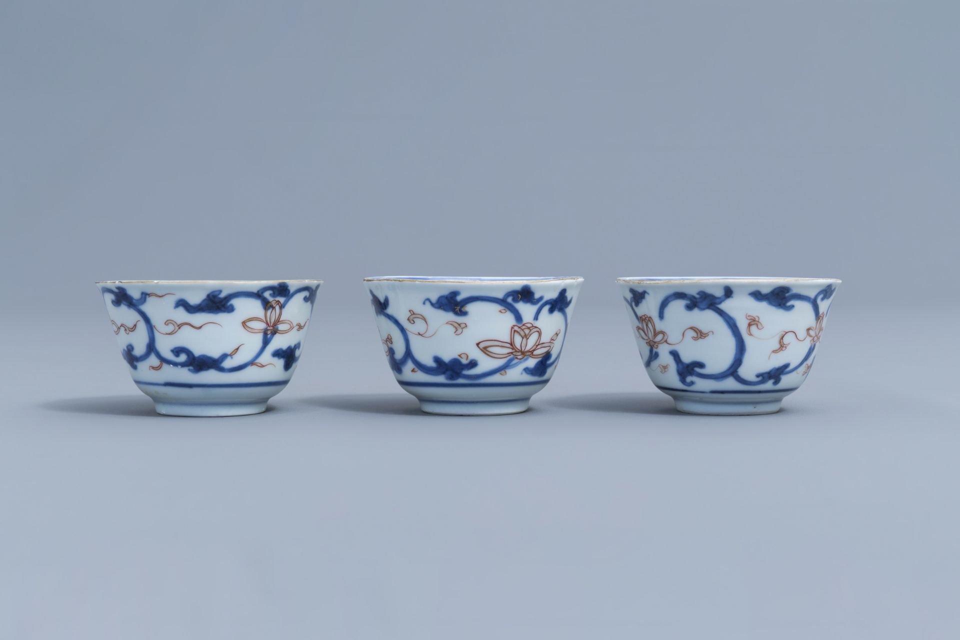 Six Chinese blue, white, iron red and gilt cups and saucers with floral design, Kangxi - Image 17 of 34