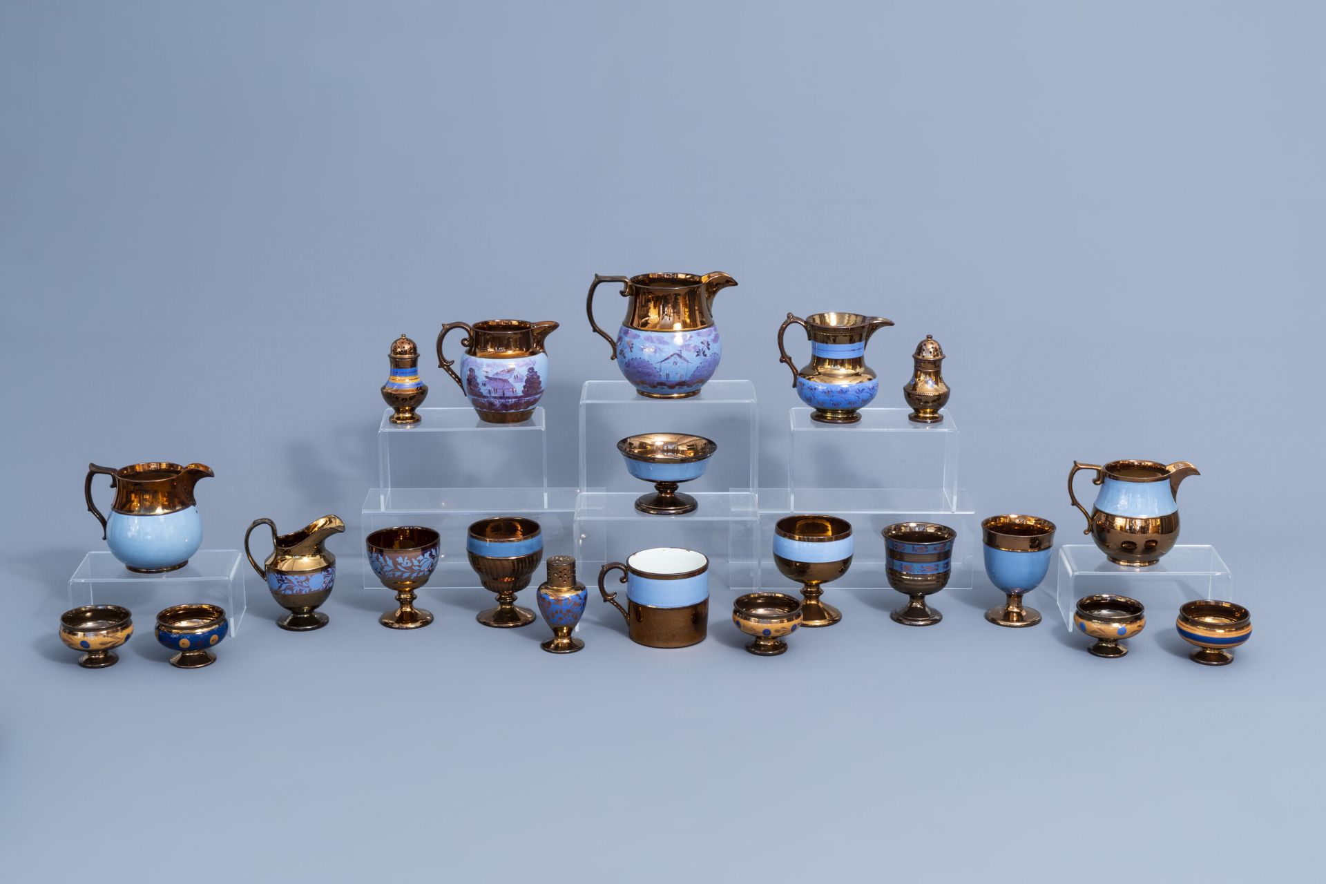 A varied collection of English lustreware items with blue design, 19th C.