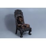 A Chinese finely carved wooden chair, 19th C.
