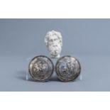 A pair of silver 'horseman' belt buckles and a marble head, various origins, 19th/20th C.