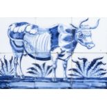 A Dutch Delft blue and white tile mural with a cow, 19th C.