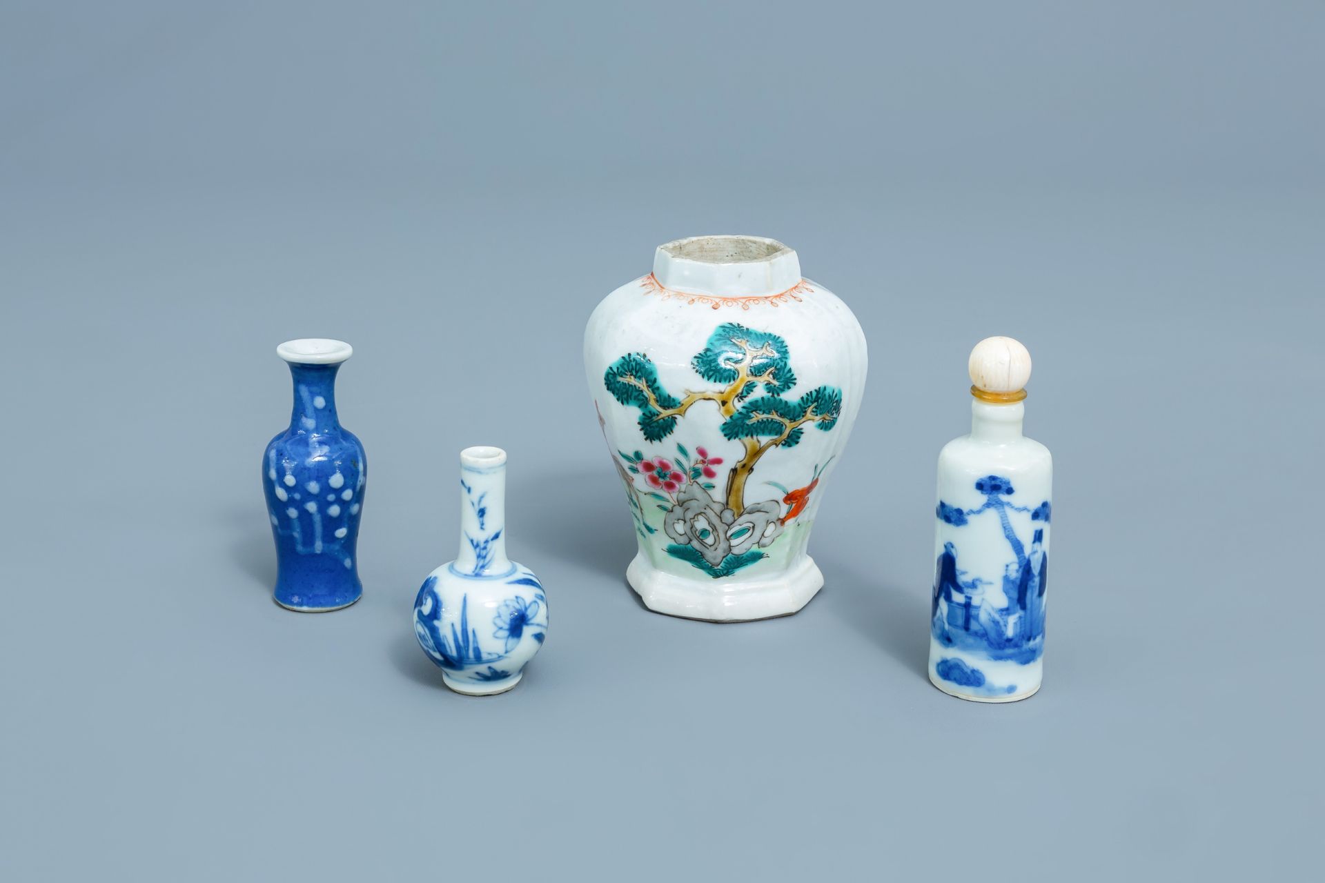 Three Chinese blue, white and famille rose miniature vases and a snuff bottle, Kangxi and later