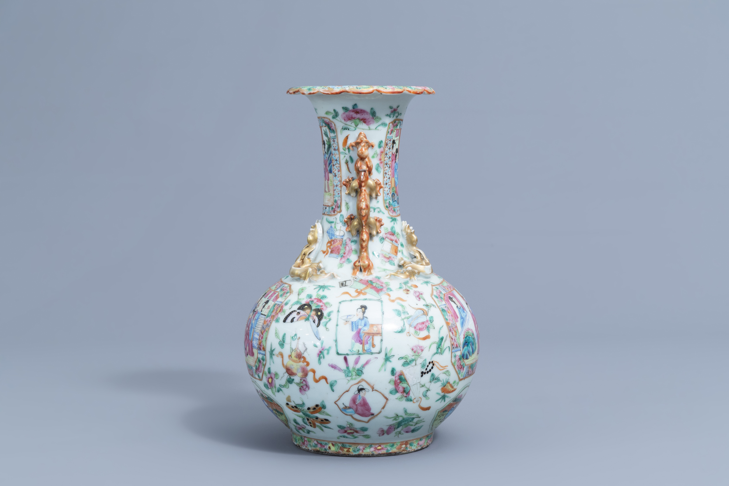 A Chinese Canton famille rose bottle vase with relief design, 19th C. - Image 4 of 6