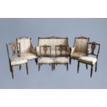 An English seven-piece mahogany salon set with inlay and floral upholstery, 19th/20th C.