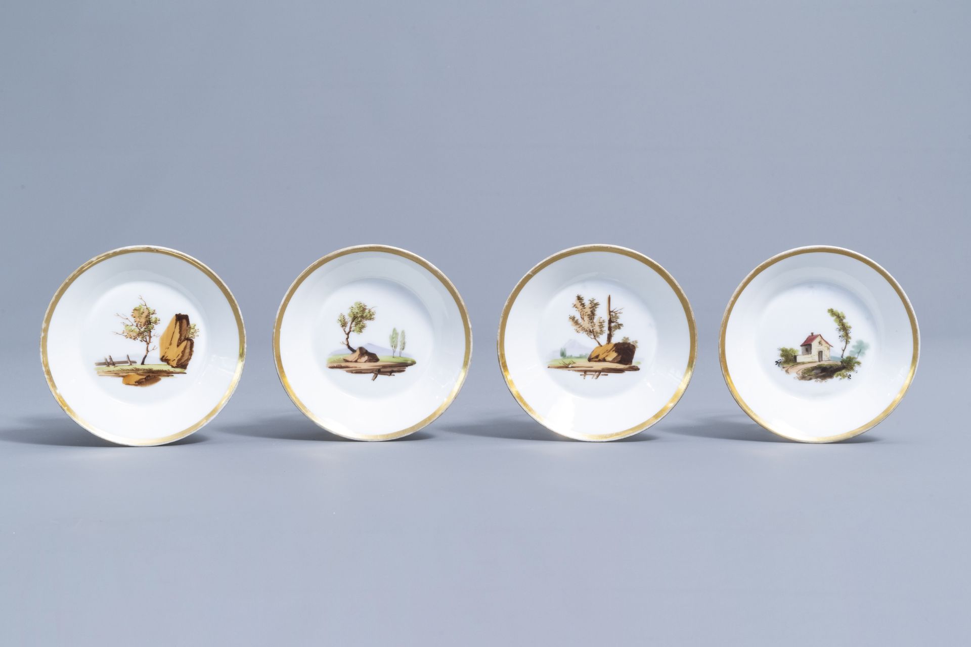 A 21-piece Paris polychrome and gilt porcelain coffee and tea service with landscapes, 19th C. - Image 28 of 46