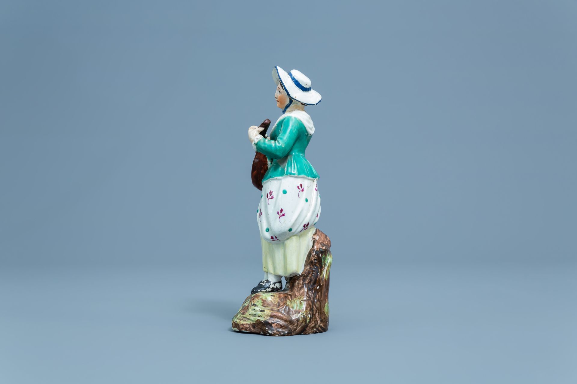 A German polychrome decorated earthenware figure of a lady with a mandolin, Hšchst, 18th C. - Image 5 of 7