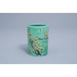 A Chinese green ground brush pot with floral relief design, Republic, 20th C.