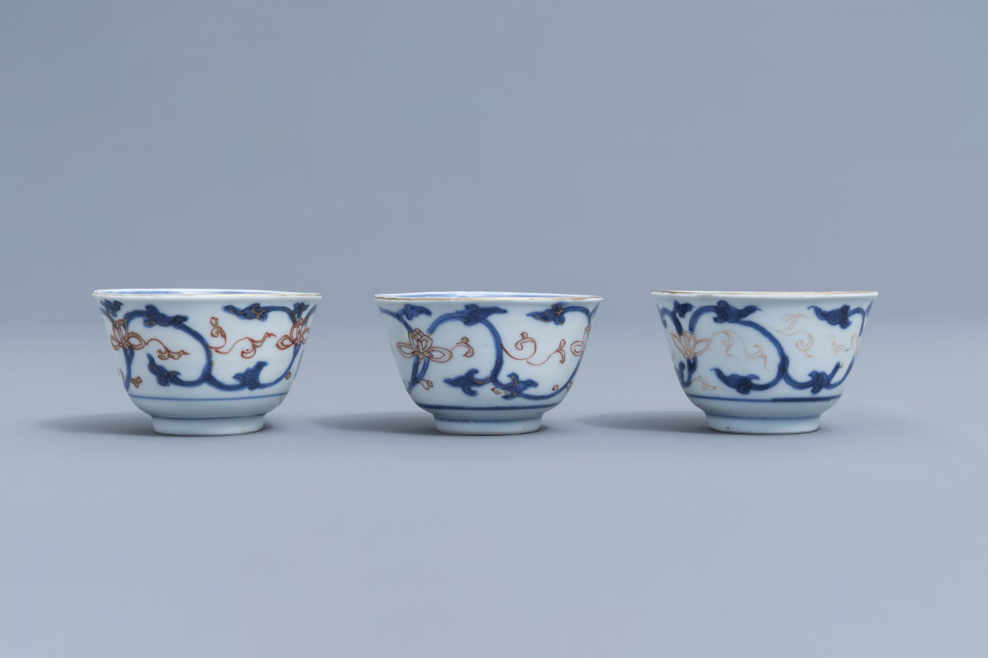 Six Chinese blue, white, iron red and gilt cups and saucers with floral design, Kangxi - Image 27 of 34