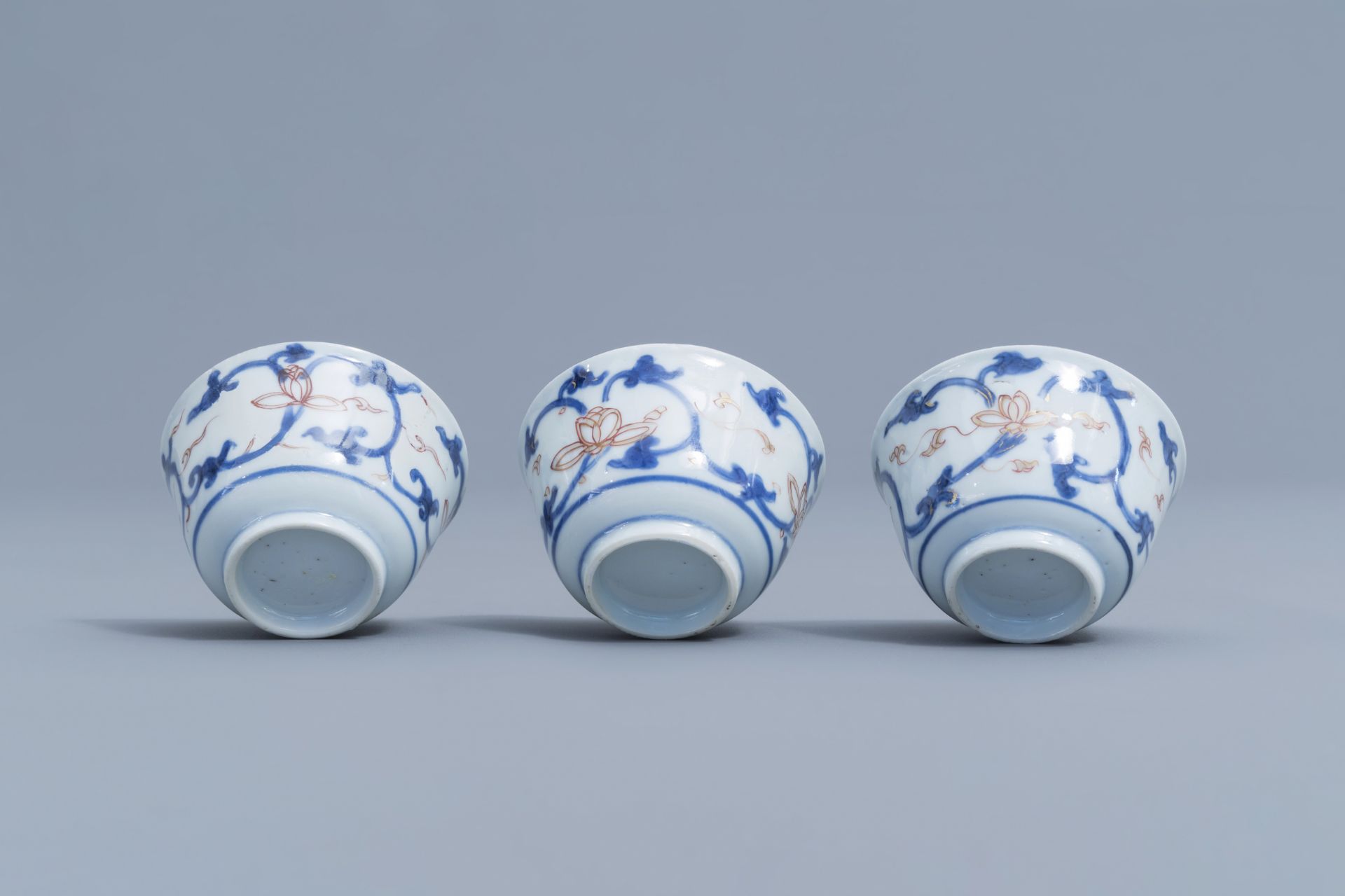 Six Chinese blue, white, iron red and gilt cups and saucers with floral design, Kangxi - Image 20 of 34
