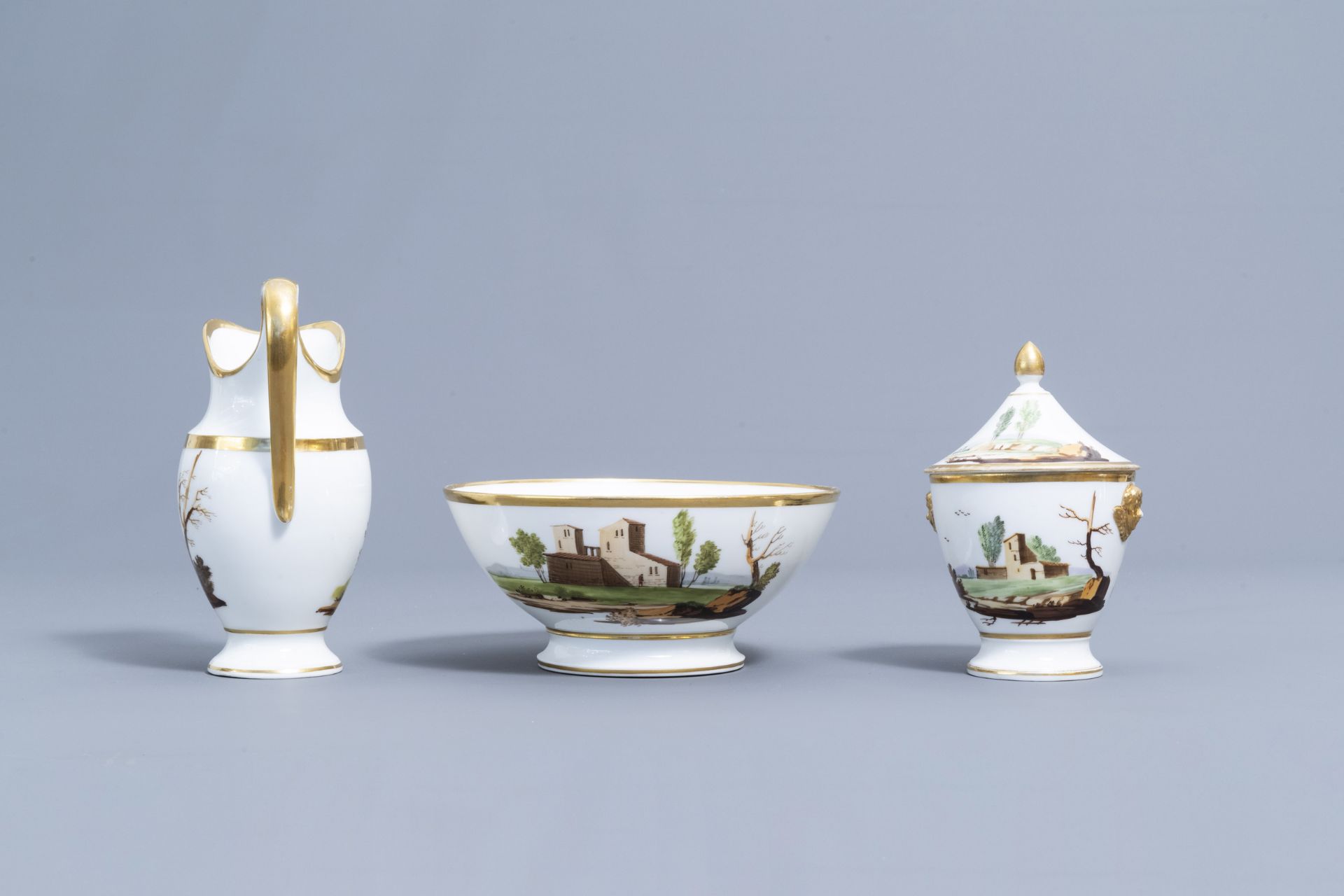 A 21-piece Paris polychrome and gilt porcelain coffee and tea service with landscapes, 19th C. - Image 20 of 46