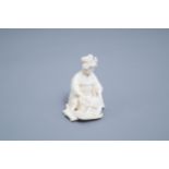 A signed Japanese ivory ikomono of a lady at work, Meiji, 19th/20th C.