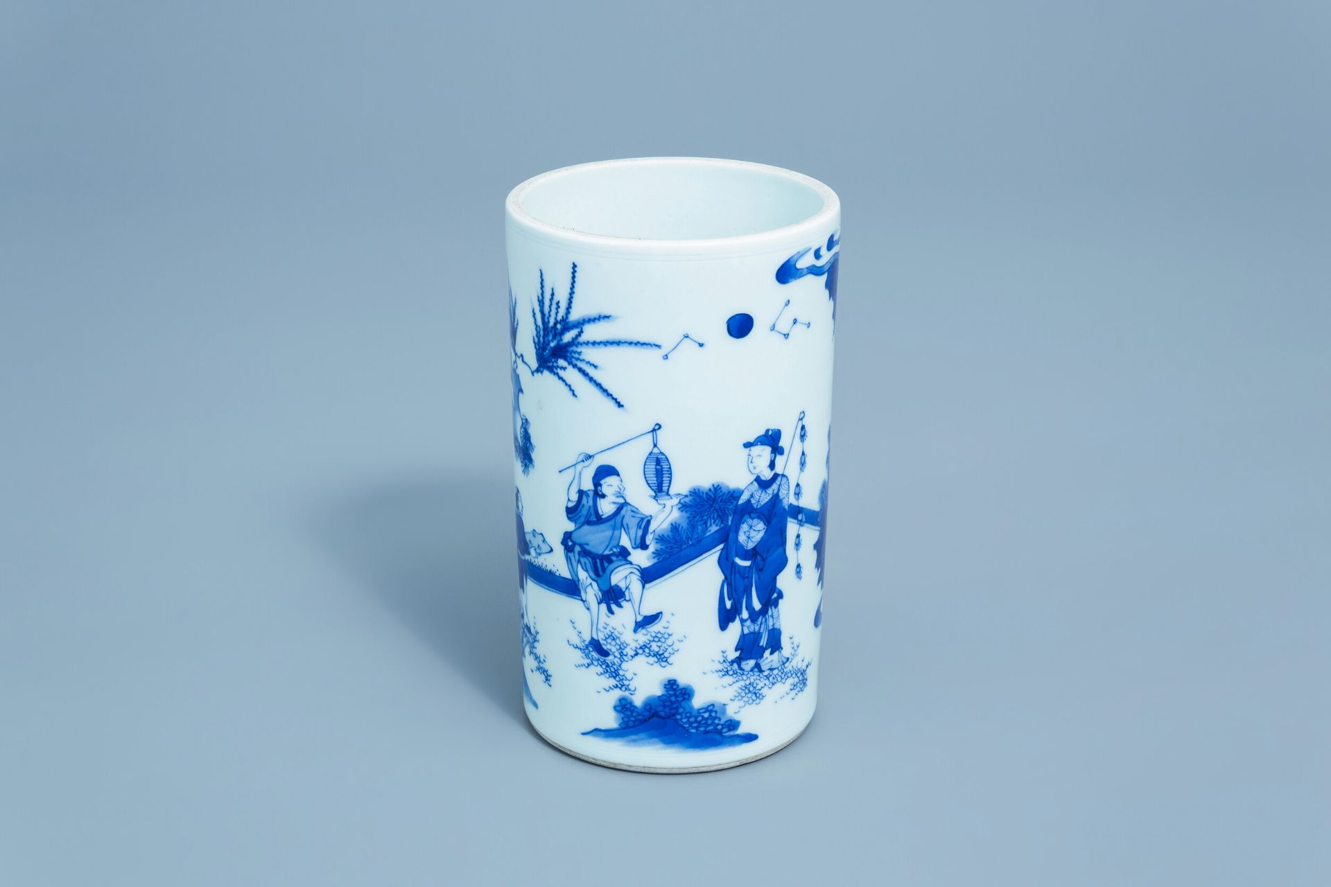 A Chinese blue and white brush pot with figures in a landscape, 20th C.