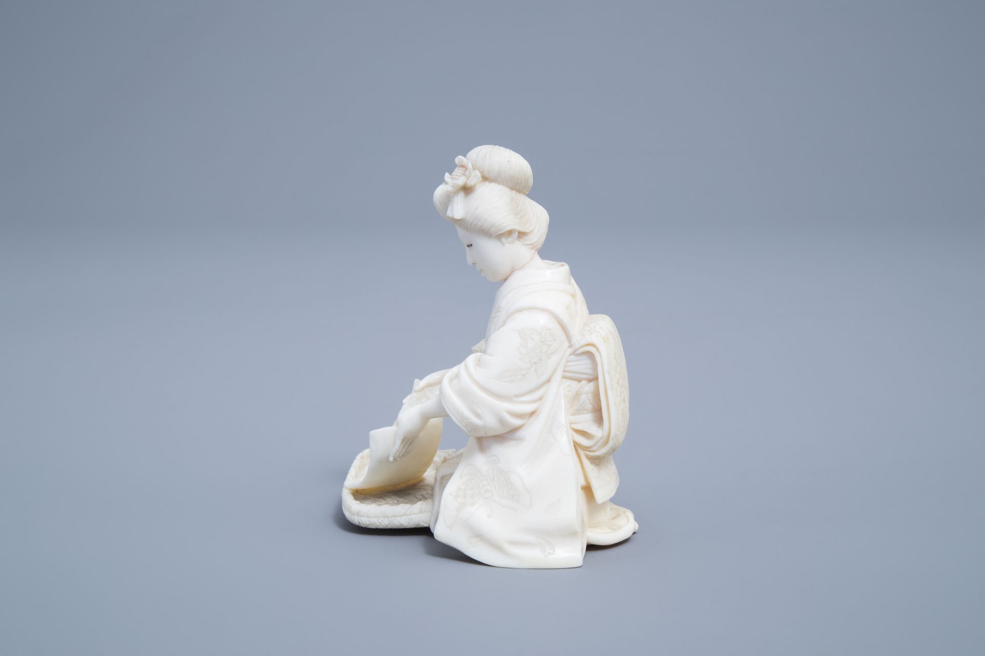 A signed Japanese ivory ikomono of a lady at work, Meiji, 19th/20th C. - Image 5 of 8