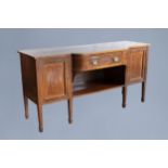 An English George III mahogany sideboard with a drawer over two doors, ca. 1800