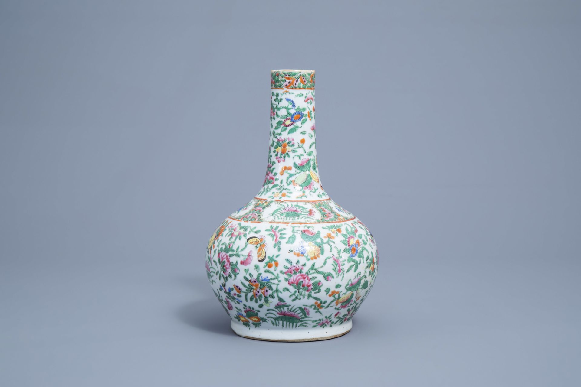 A Chinese Canton famille rose bottle vase with floral design, 19th C. - Image 3 of 7