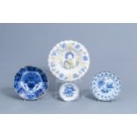 A Dutch Delft polychrome gadrooned dish and three blue and white plates, 17th/18th C.