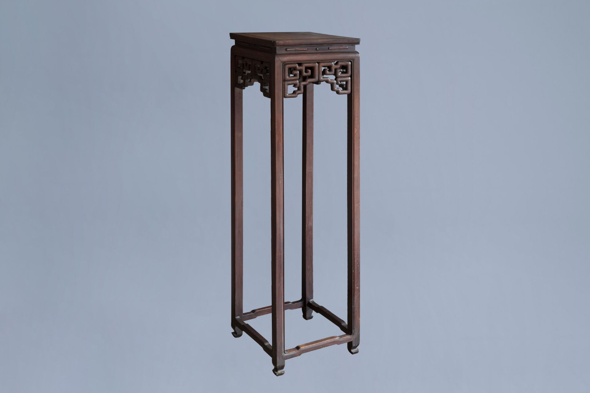 A Chinese carved wooden stand with burl wood top, 19th/20th C.