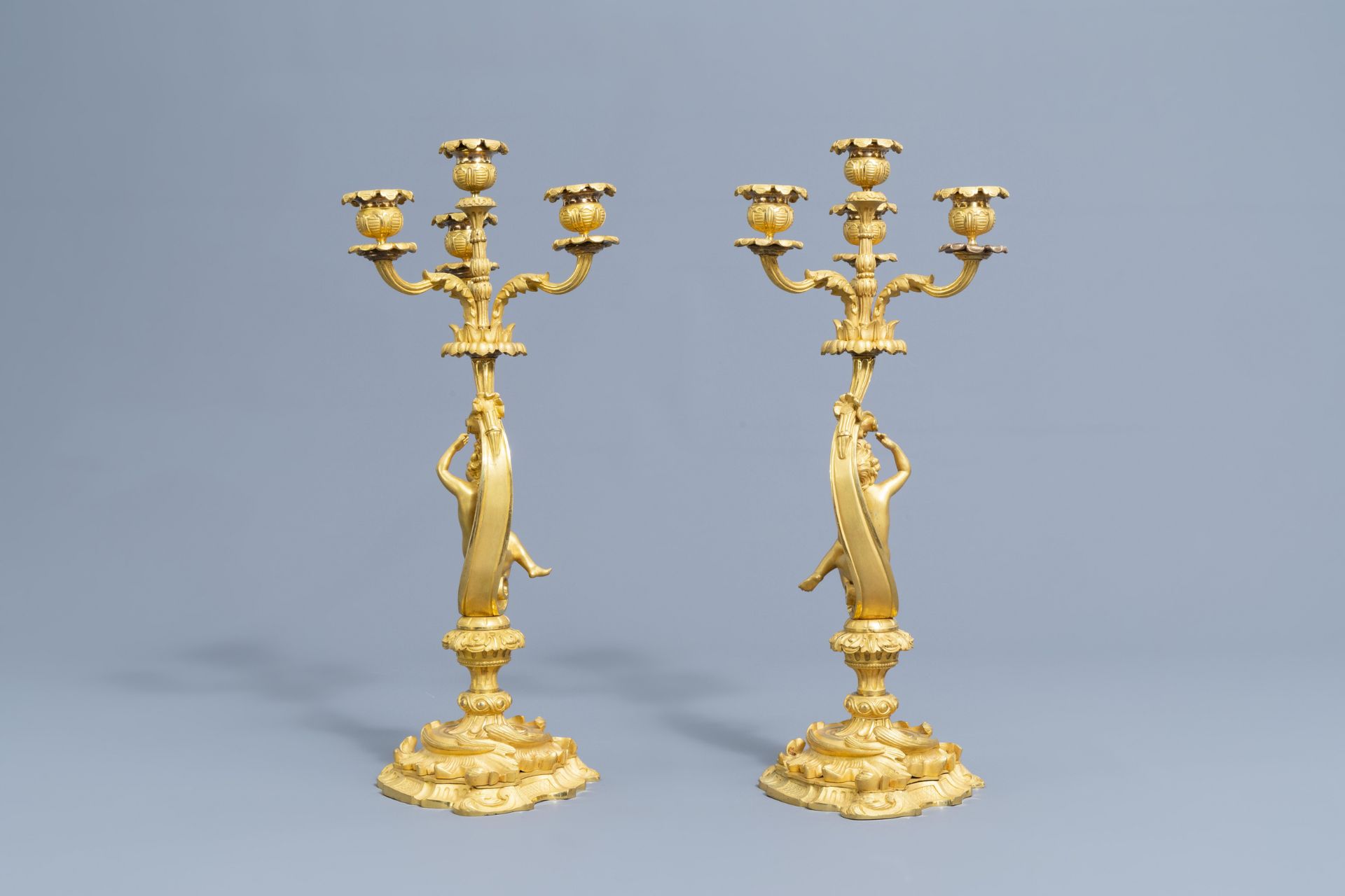 A French gilt bronze mounted Sevres style clock and a pair of Louis XV style candelabra, 19th C. - Image 20 of 23