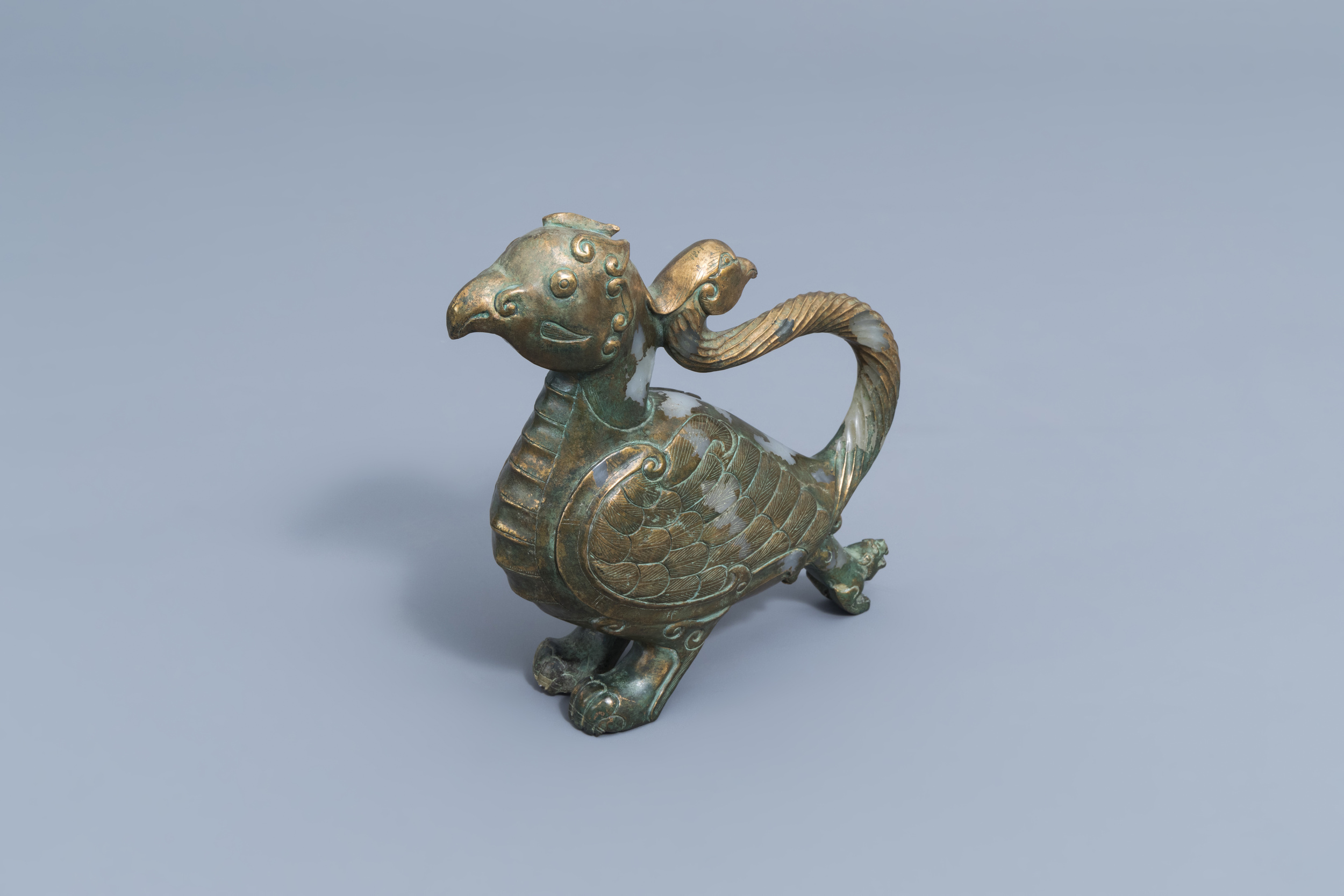 A Chinese partly gilt jade or hardstone bird, 19th/20th C.