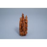 A Chinese carved wooden group with four figures, 19th/20th C.