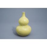 A Chinese monochrome yellow double gourd vase, Qianlong mark, 19th/20th C.