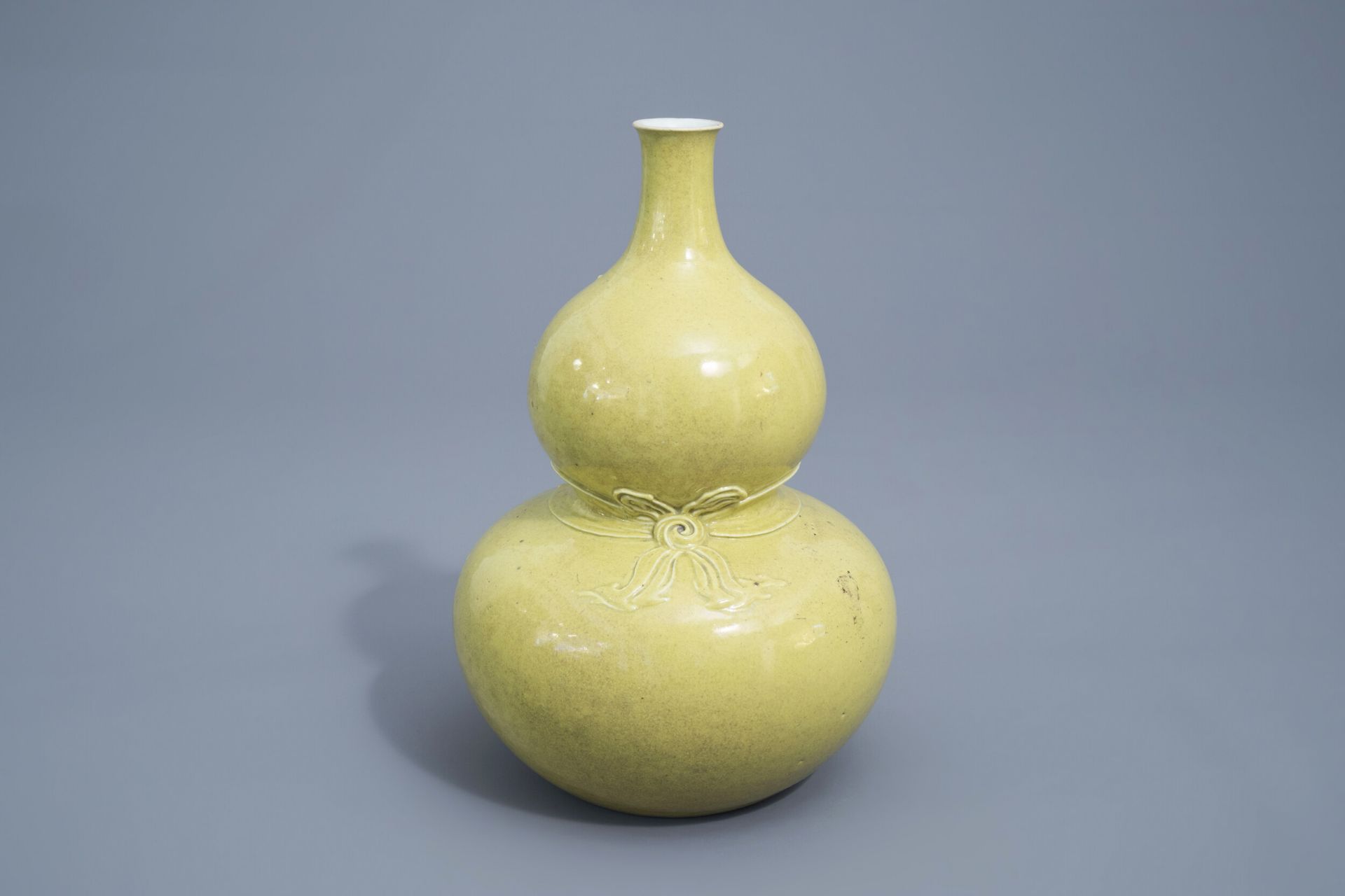 A Chinese monochrome yellow double gourd vase, Qianlong mark, 19th/20th C.