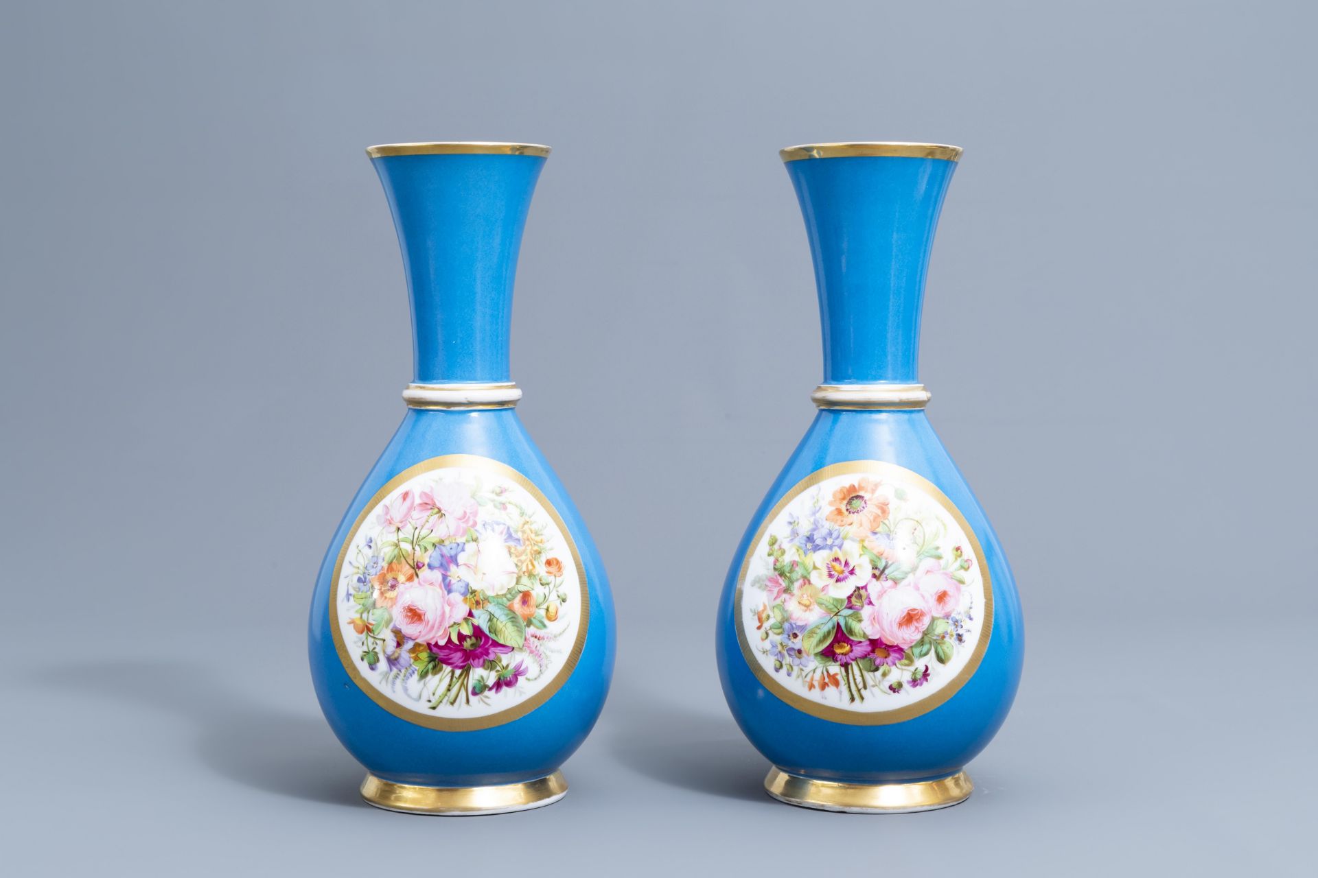 A pair of French 'bleu celeste' ground vases with gallant scenes and a German gilt charger, 20th C. - Image 8 of 24