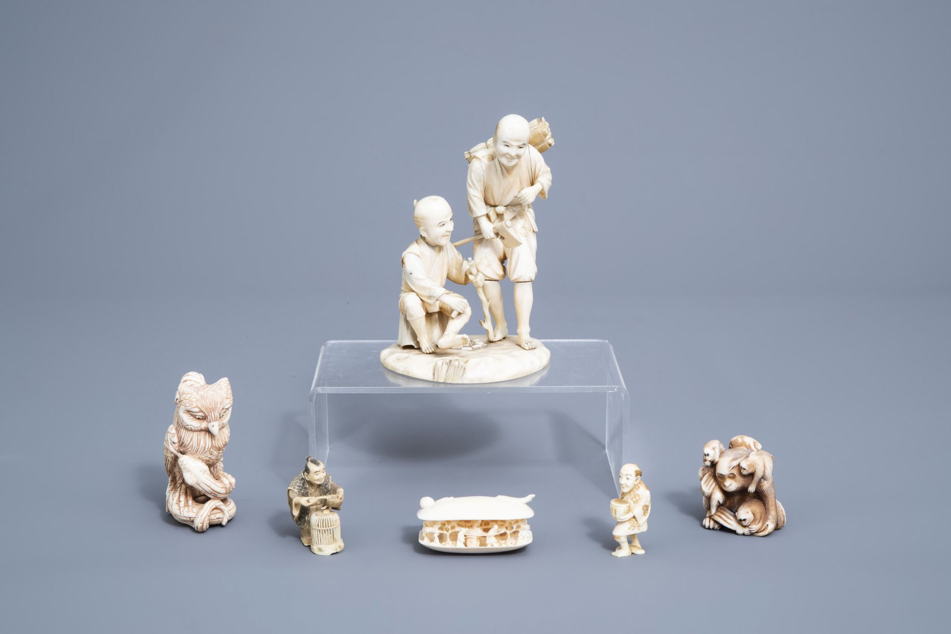 Five various Japanese ivory netsuke and okimono, Meiji, and a Chinese Canton shell, 19th/20th C.