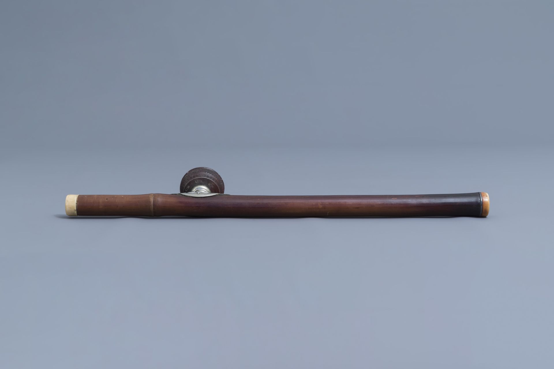 A Chinese bamboo opium pipe, an ivory mouth- and endpiece and a stoneware damper, 19th C. - Image 6 of 9