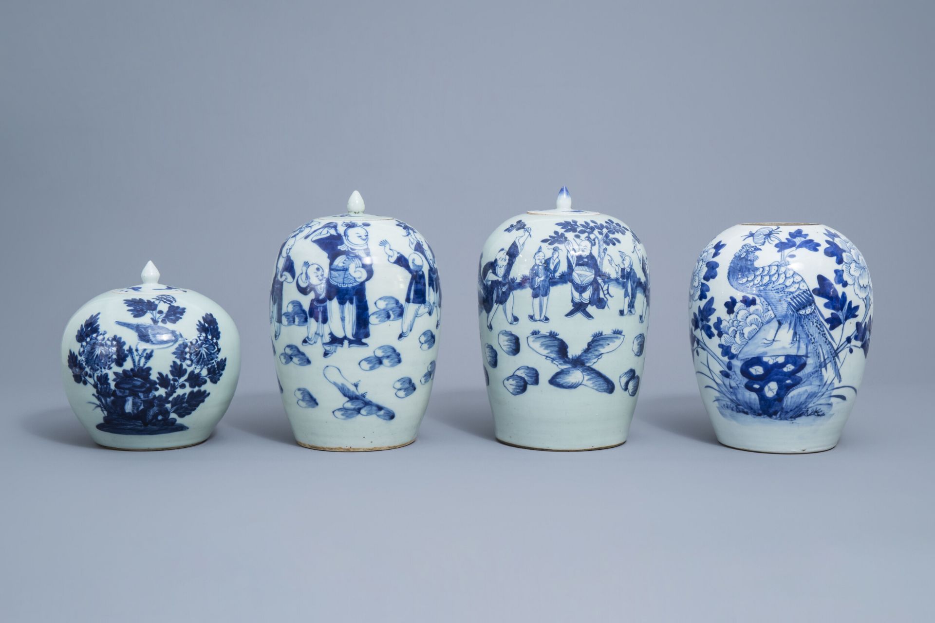 Four various Chinese blue, white and celadon ginger jars and jars and covers, 19th/20th C.